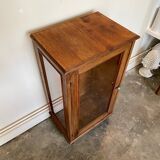 Dark wood display case and transparent glass