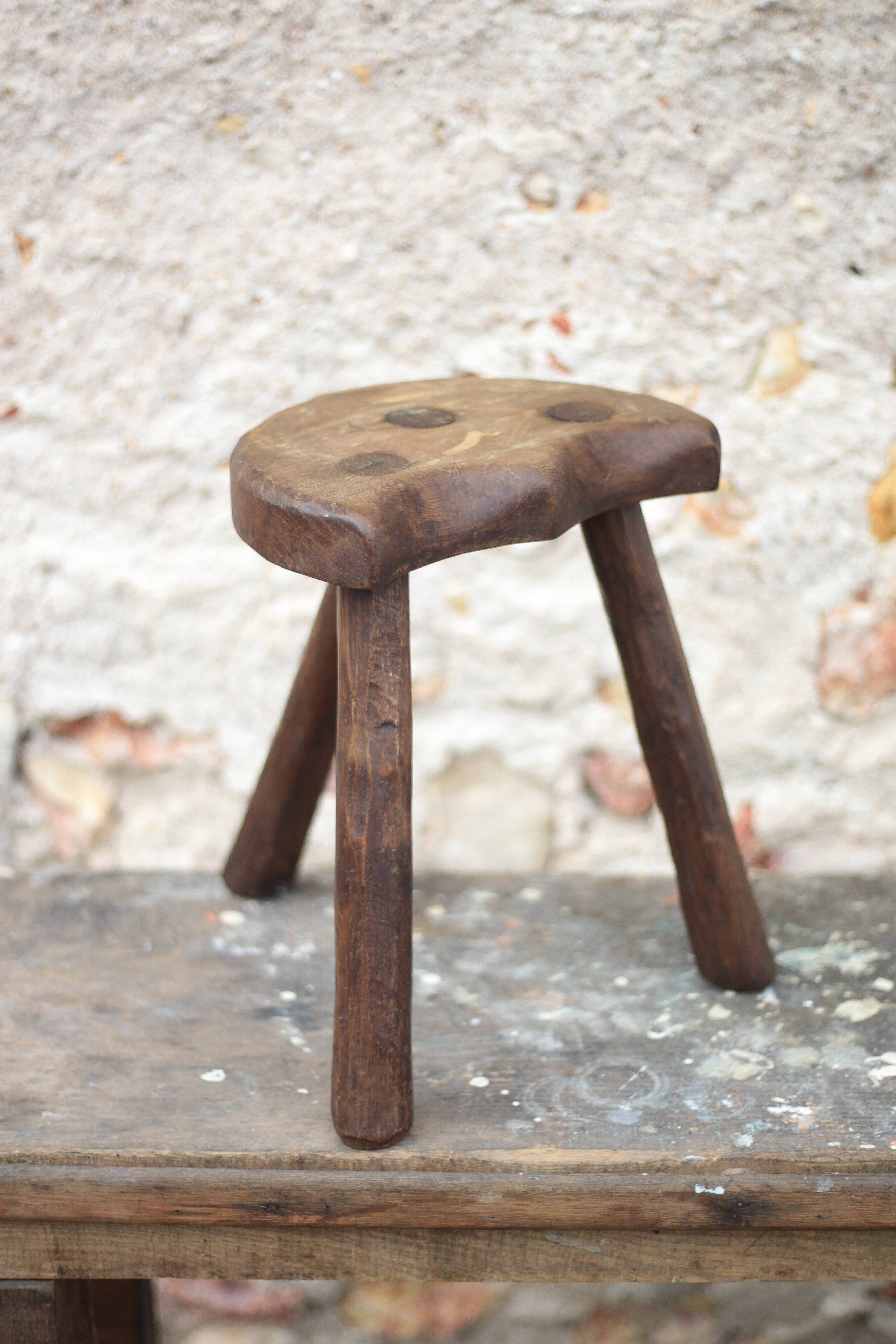 Vintage wooden tripod stool, mountain work, wabi-sabi, shepherd.
