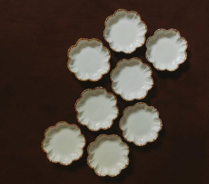 Set of eight small bread plates in white Limoges porcelain