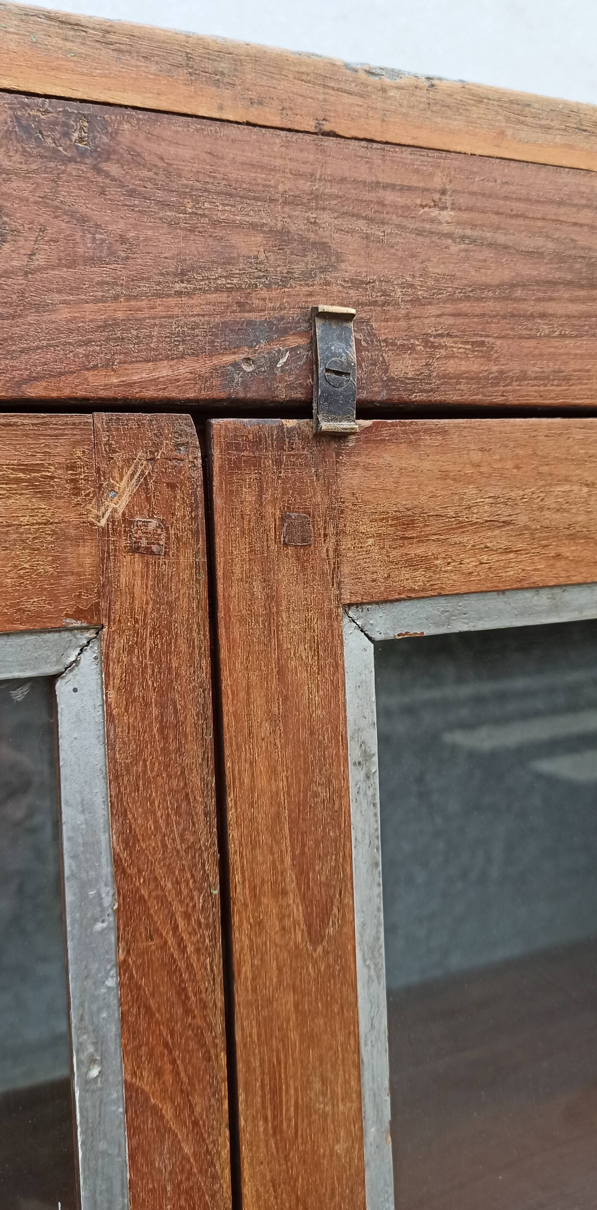 Old glass cabinet in wood and metal