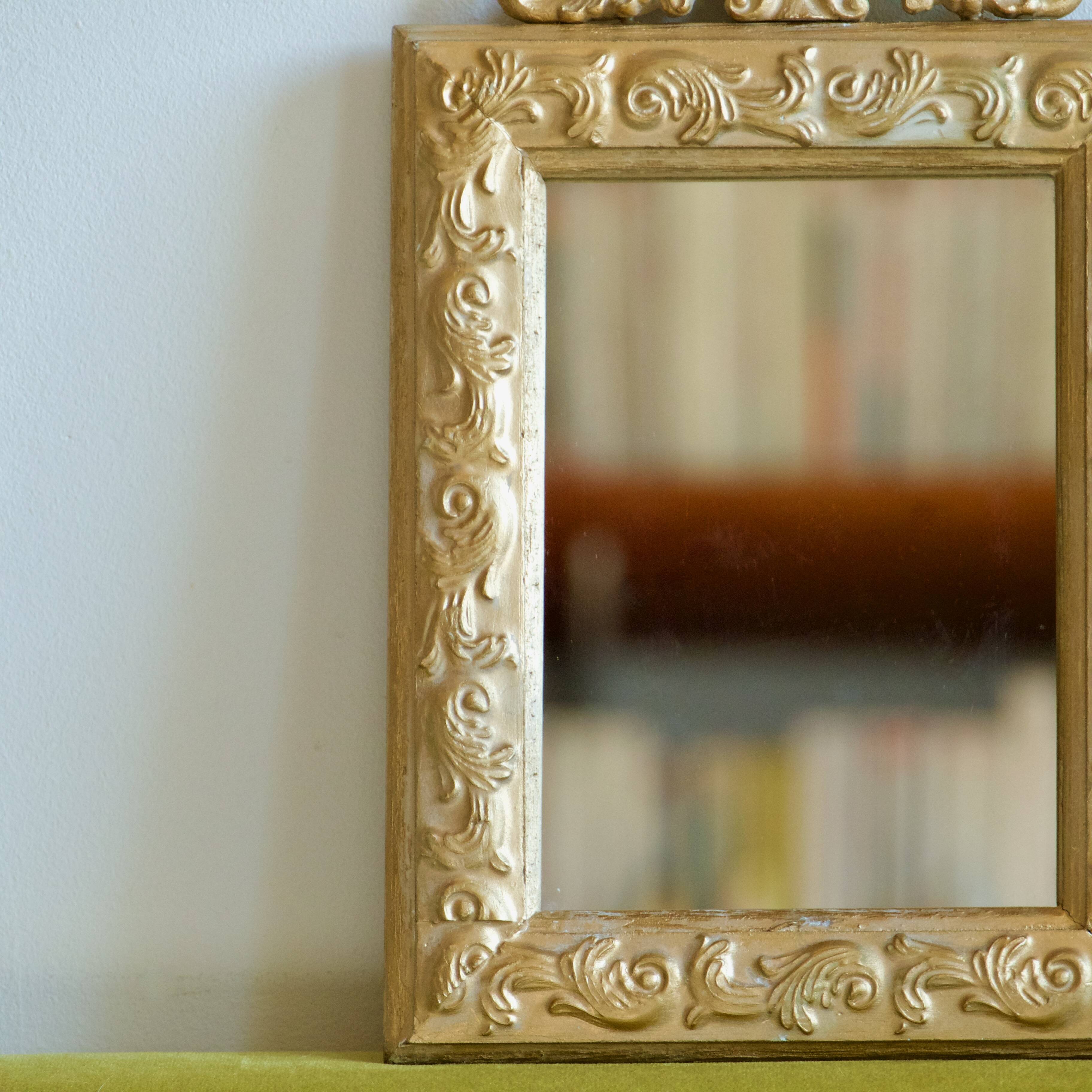 Antique gilded shell mirror with arabesque moldings