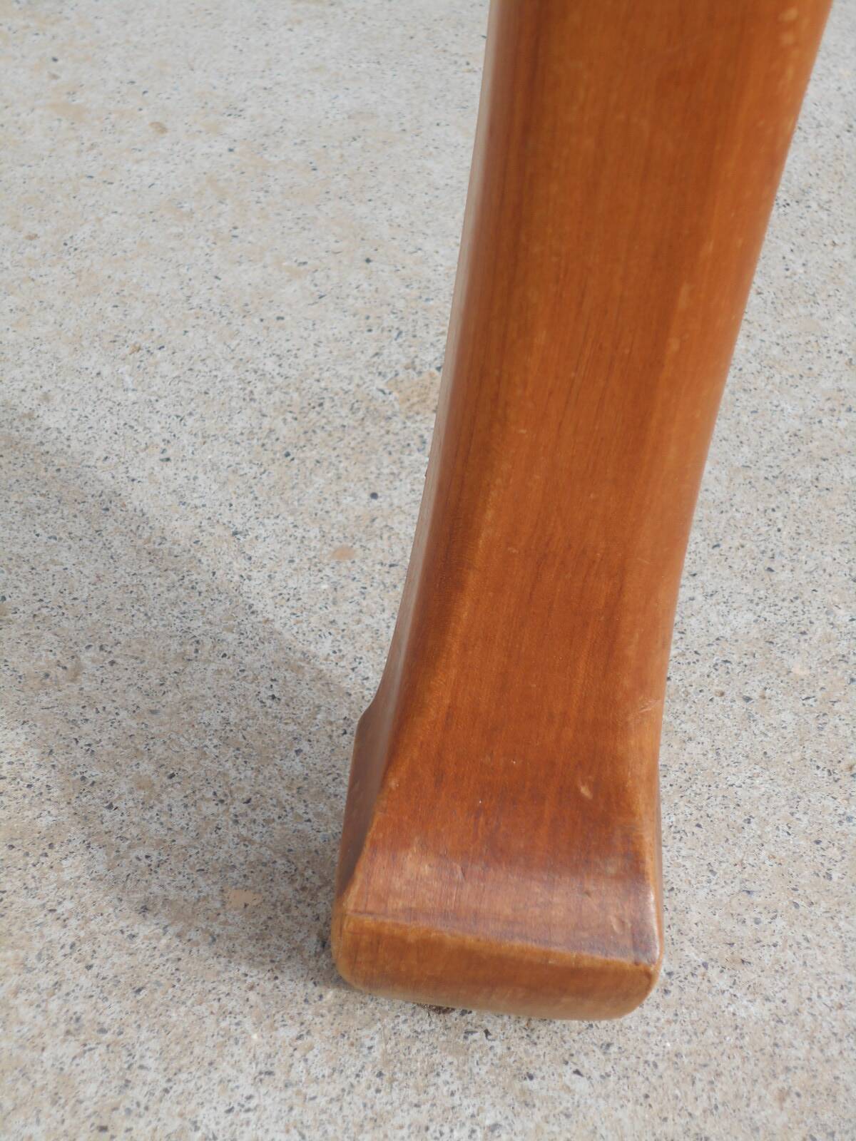 Large solid wood table with integrated extensions.