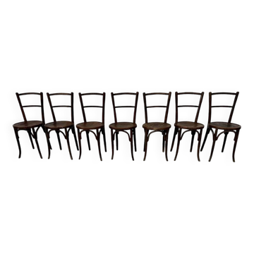 Série de 7 anciennes chaises bistrot Baumann bois courbé assise ronde
