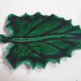 empty green ceramic pocket cup, small chips on the edges, signed