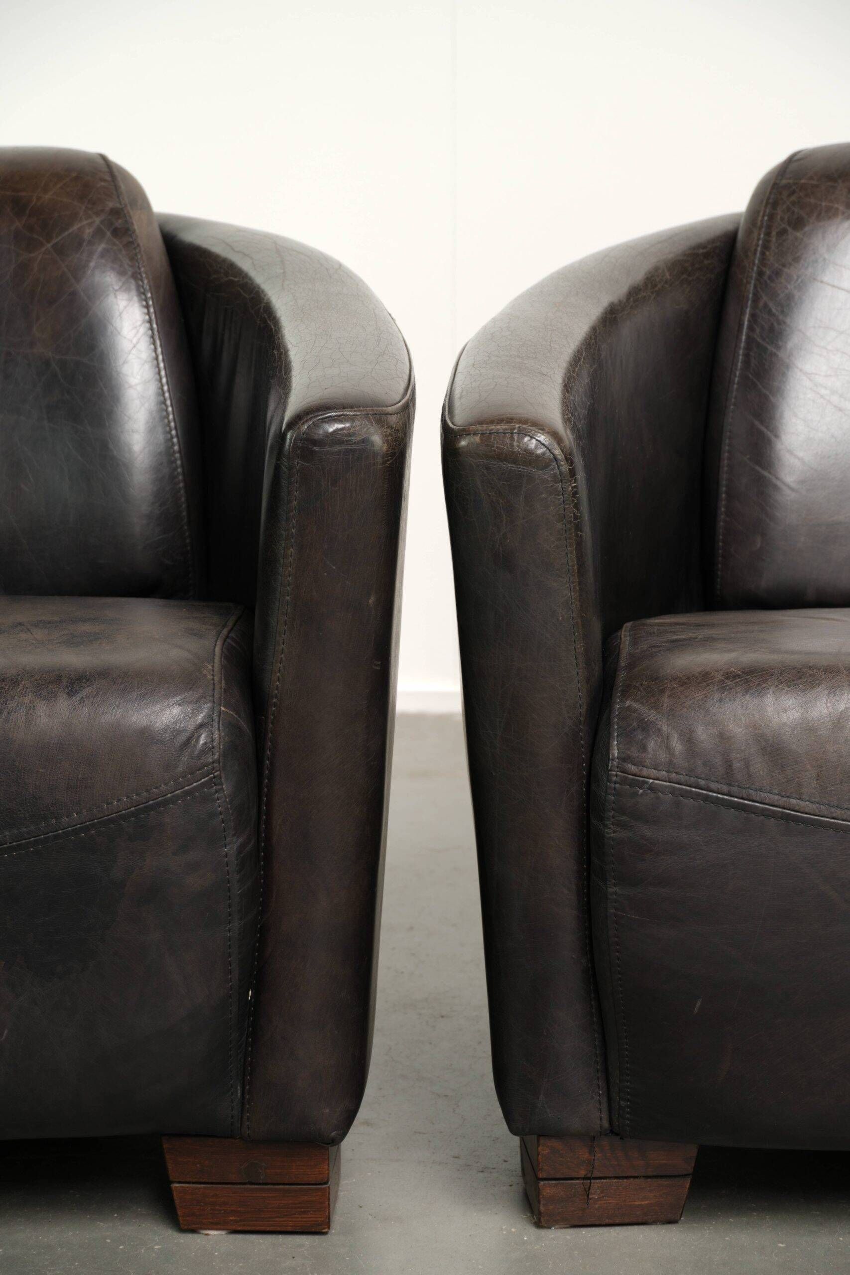 Ensemble vintage de 2 fauteuils en cuir de vachette au design Aviateur.