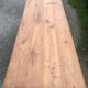 Antique Louis Philippe style farm table in solid cherry wood with 2 drawers and turned base.