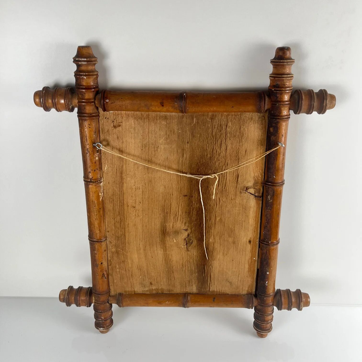 Wooden turned mirror in bamboo style, circa 1900-1930.