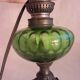 Antique oil lamp with lampshade, for table use.