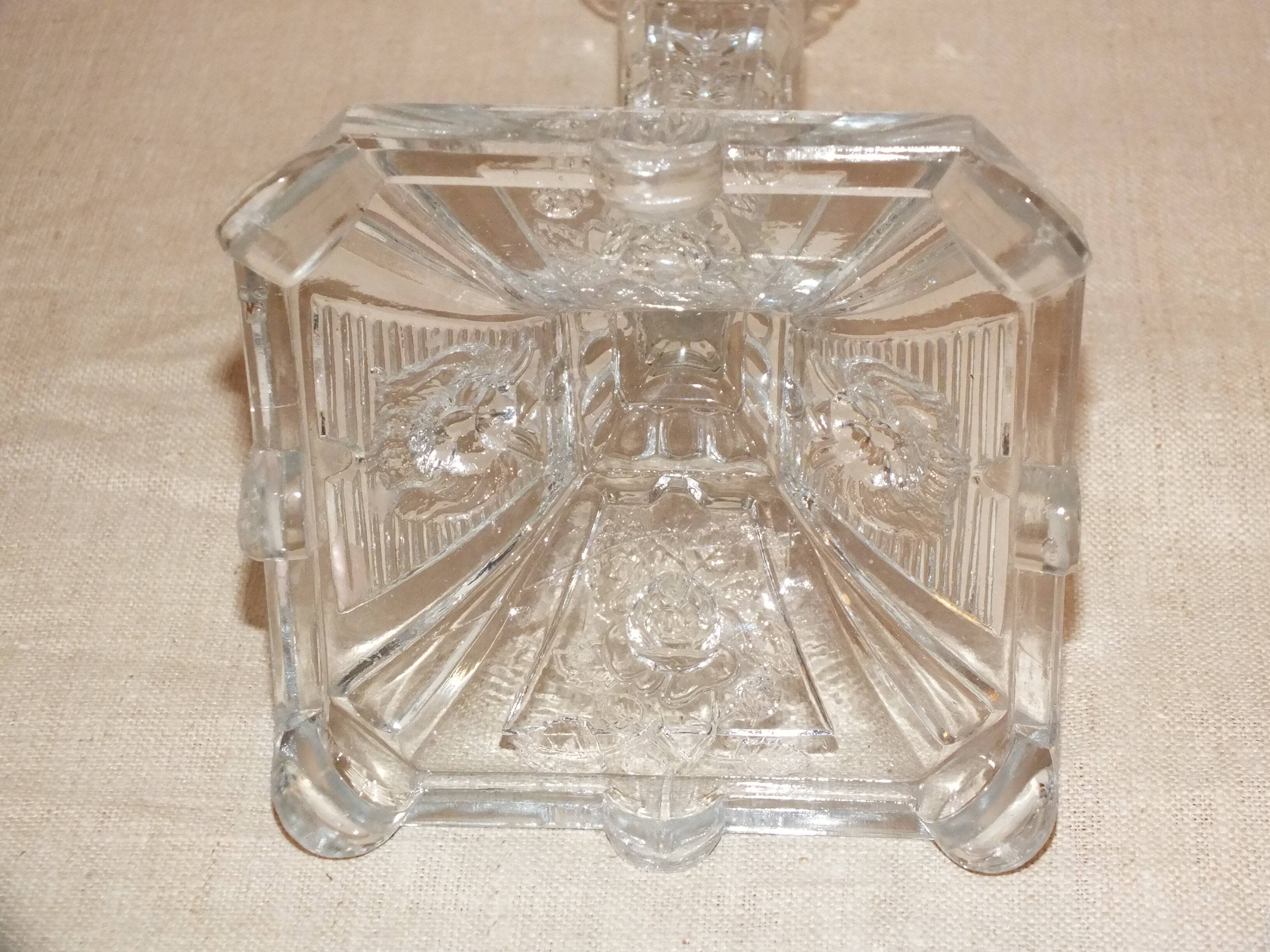 19th century candlestick in molded glass decorated with roses and lions