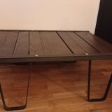 Raw wood and wrought iron coffee table