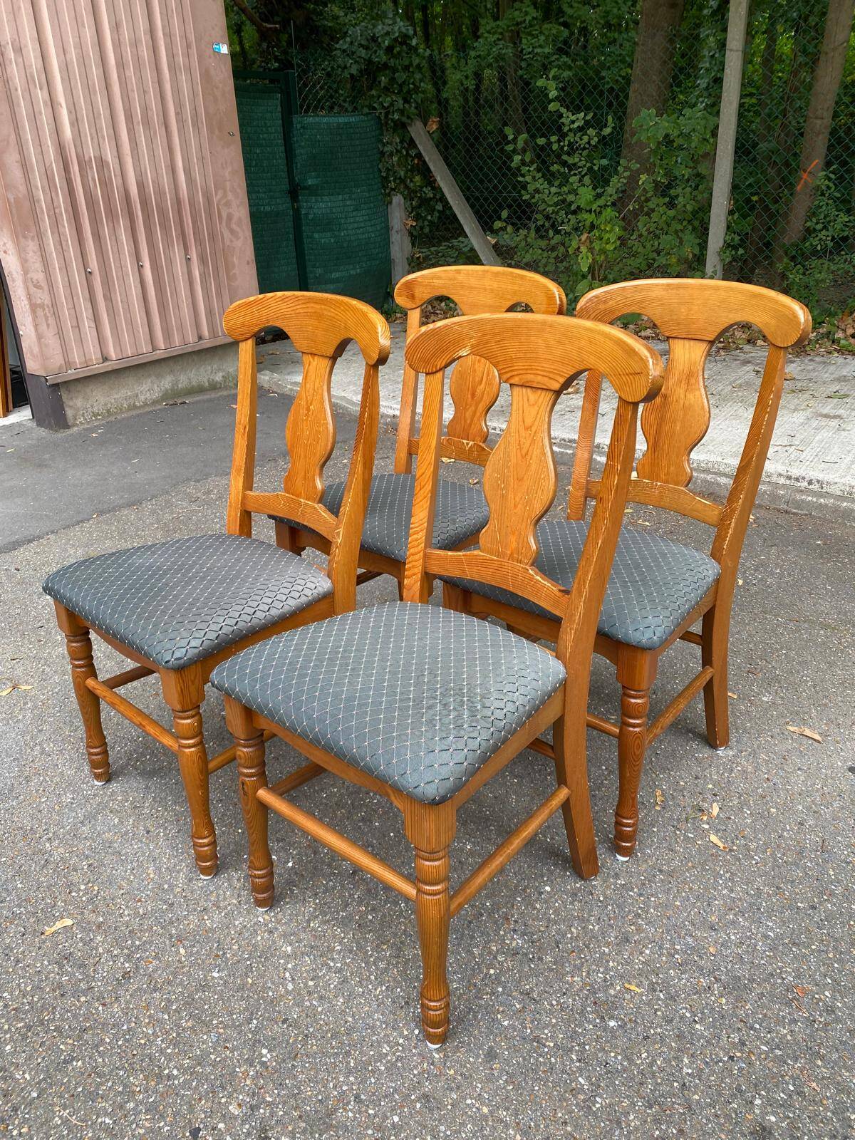 4 Landes chairs with solid wood frames and grey fabric.