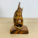Piranha naturalized on base cabinet of curiosity