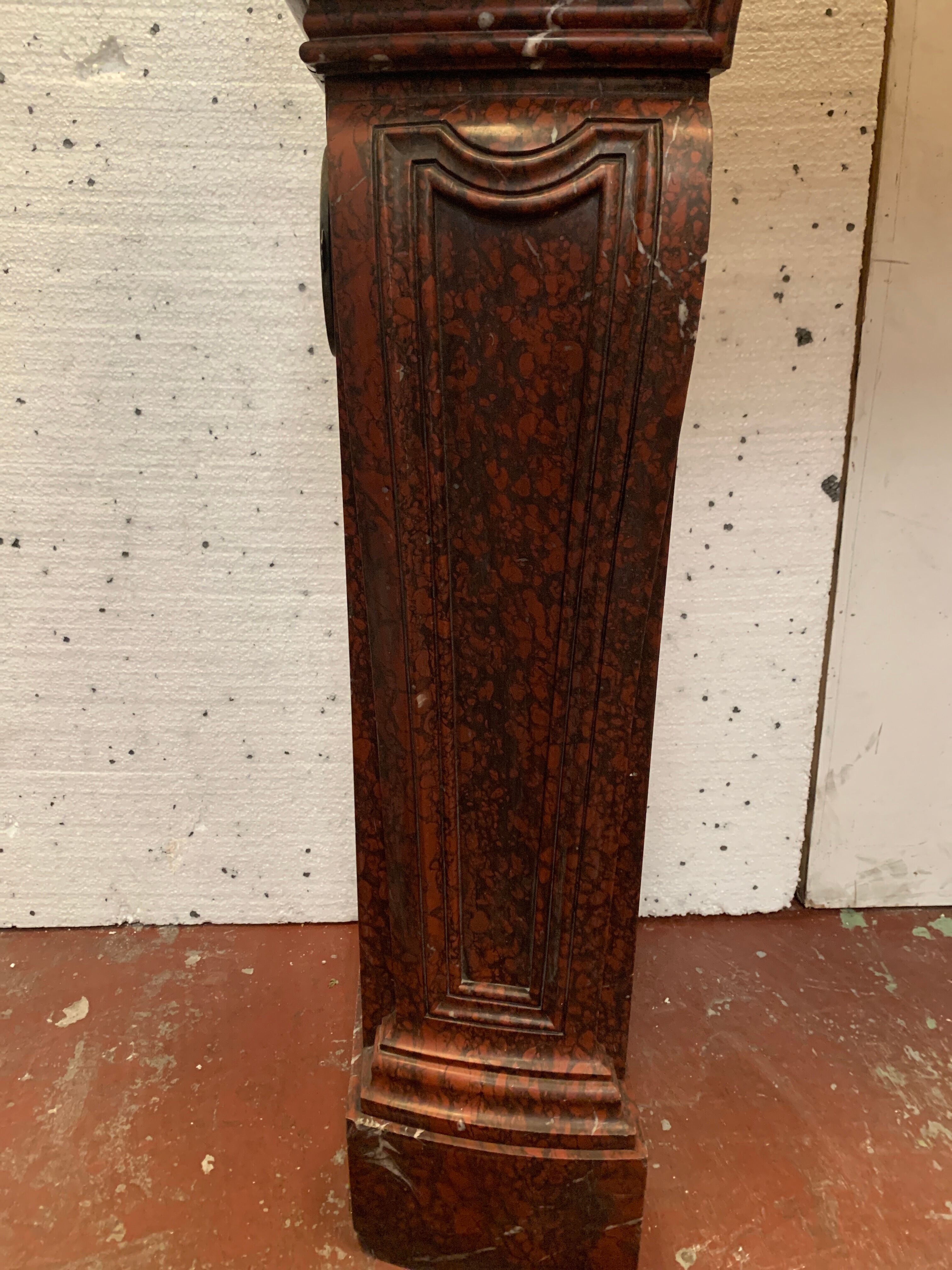 Pair of Louis XIV style fireplaces in red cherry marble. XIX century.