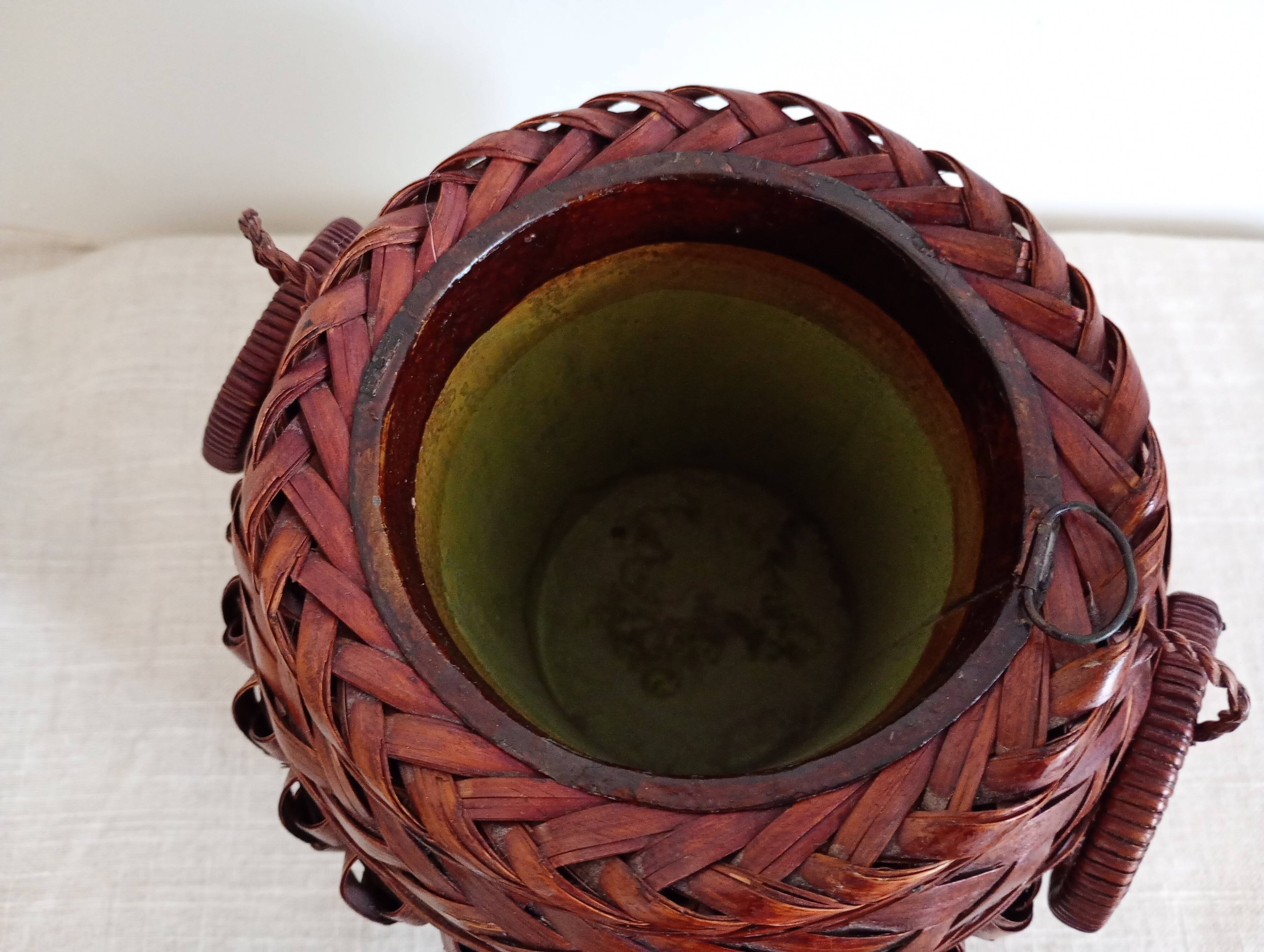 Japanese vase made of woven bamboo. Ikebana.