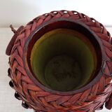 Japanese vase made of woven bamboo. Ikebana.