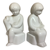 Pair of bookends featuring children reading from the 1970s.