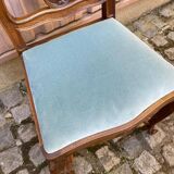 Vintage Louis XV chair made of carved solid wood with blue velvet fabric.