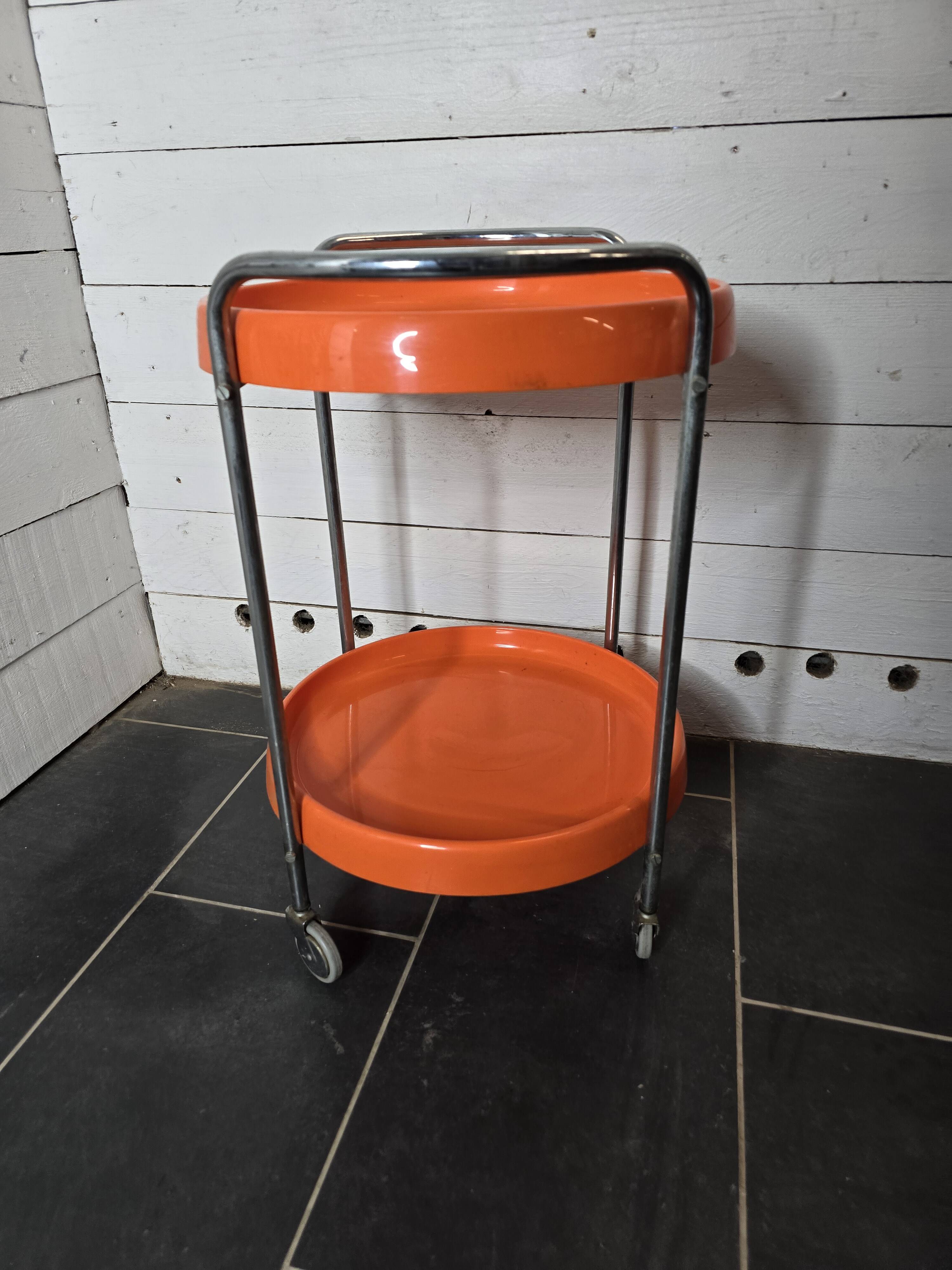 Orange trolley on wheels from the 70s