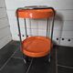 Orange trolley on wheels from the 70s