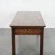 Antique French farmhouse table with two drawers and an extendable leaf.
