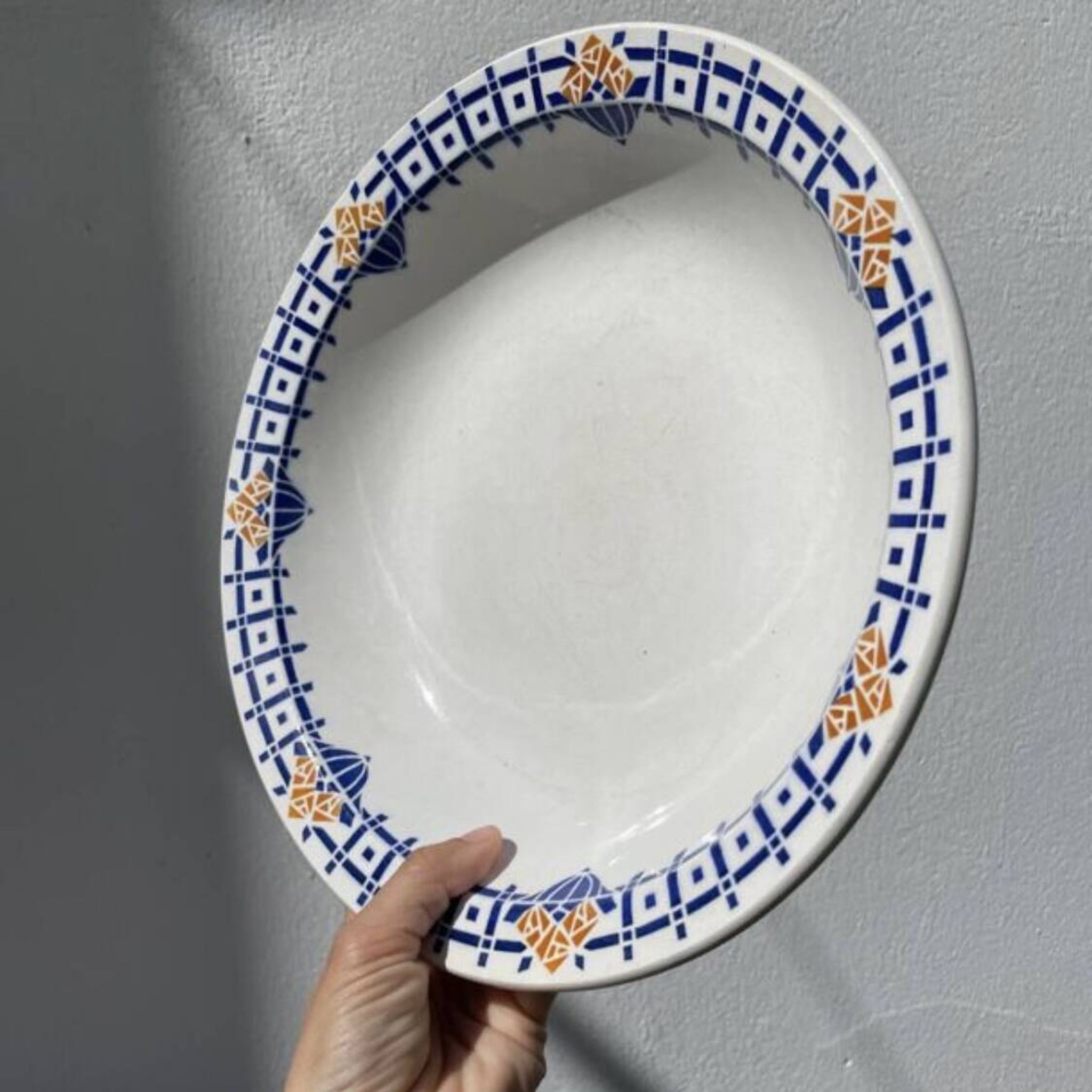 Round, shallow ceramic salad bowl from Saint Amand
