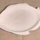 Serving dish in the shape of a white glazed ceramic fish