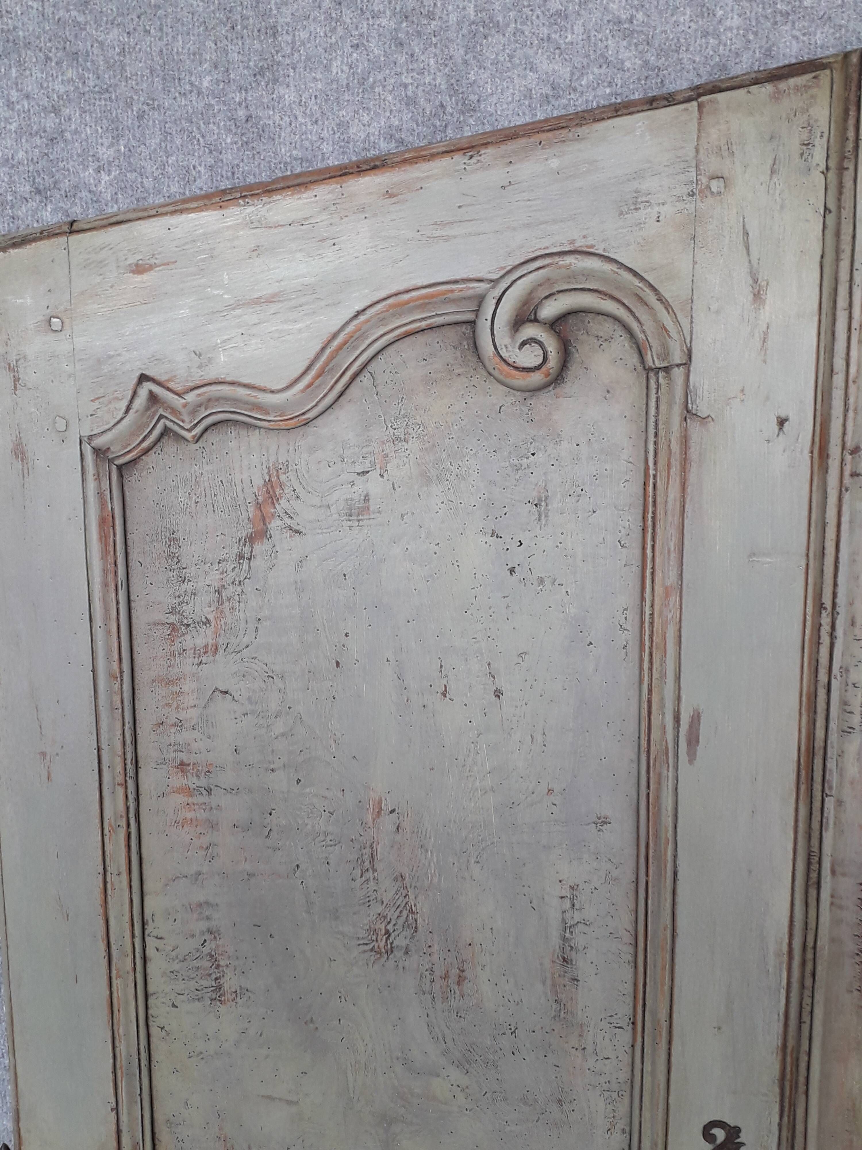 Pair of Louis XV period walnut and ash cabinet doors