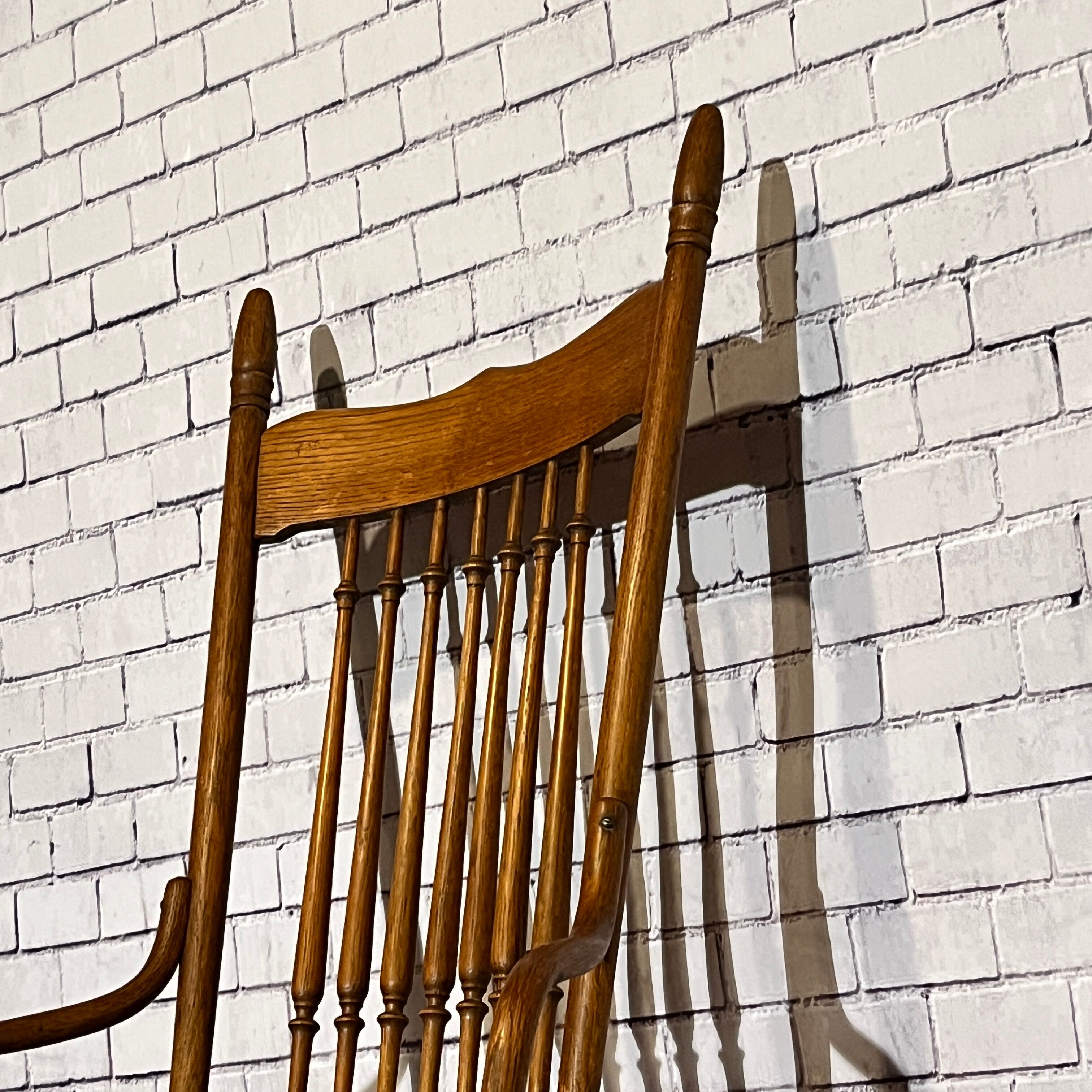 Wooden armchair with high back