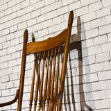 Wooden armchair with high back