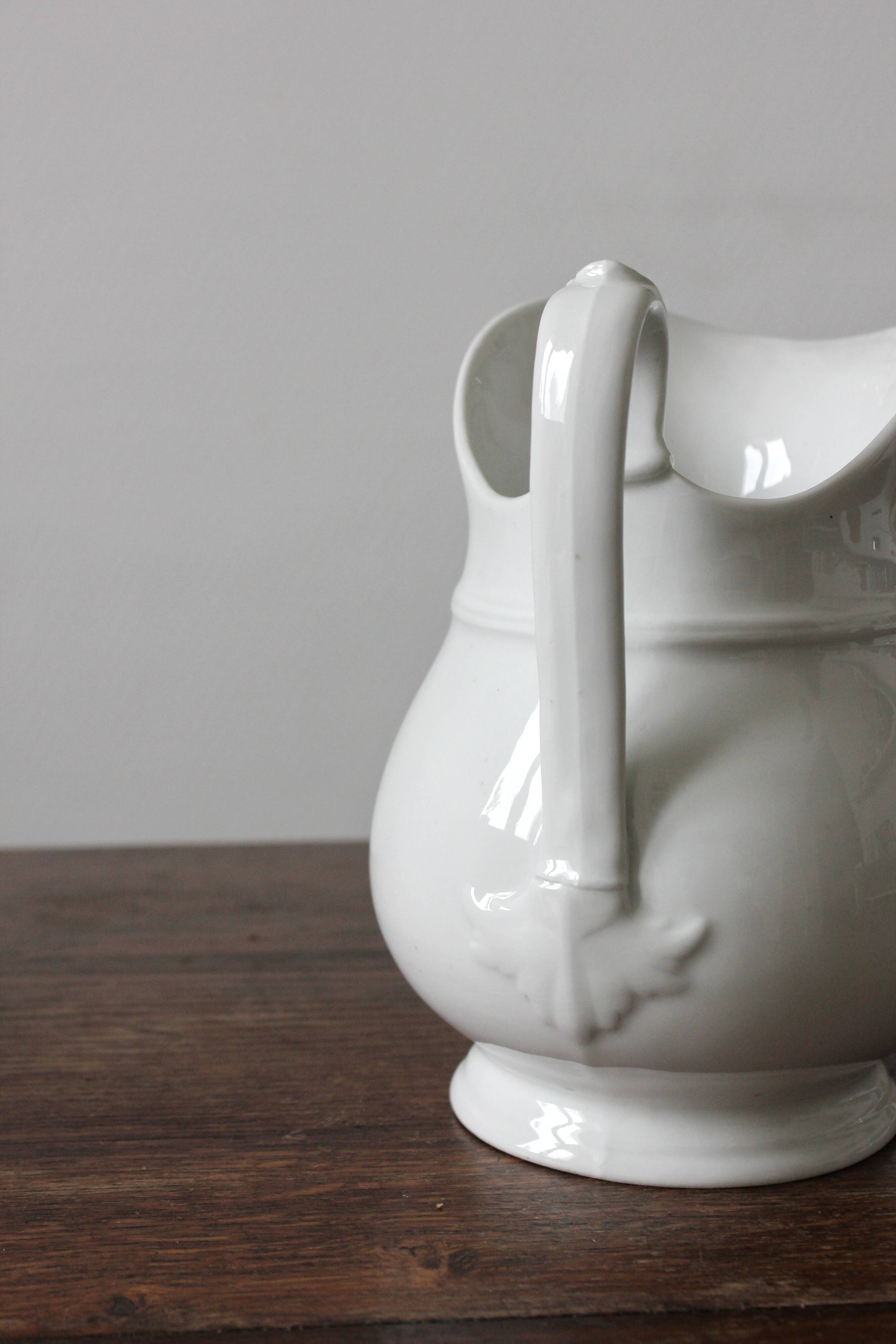 Old broc in white earthenware