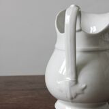 Old broc in white earthenware