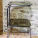 Chrome metal and smoked glass side table.