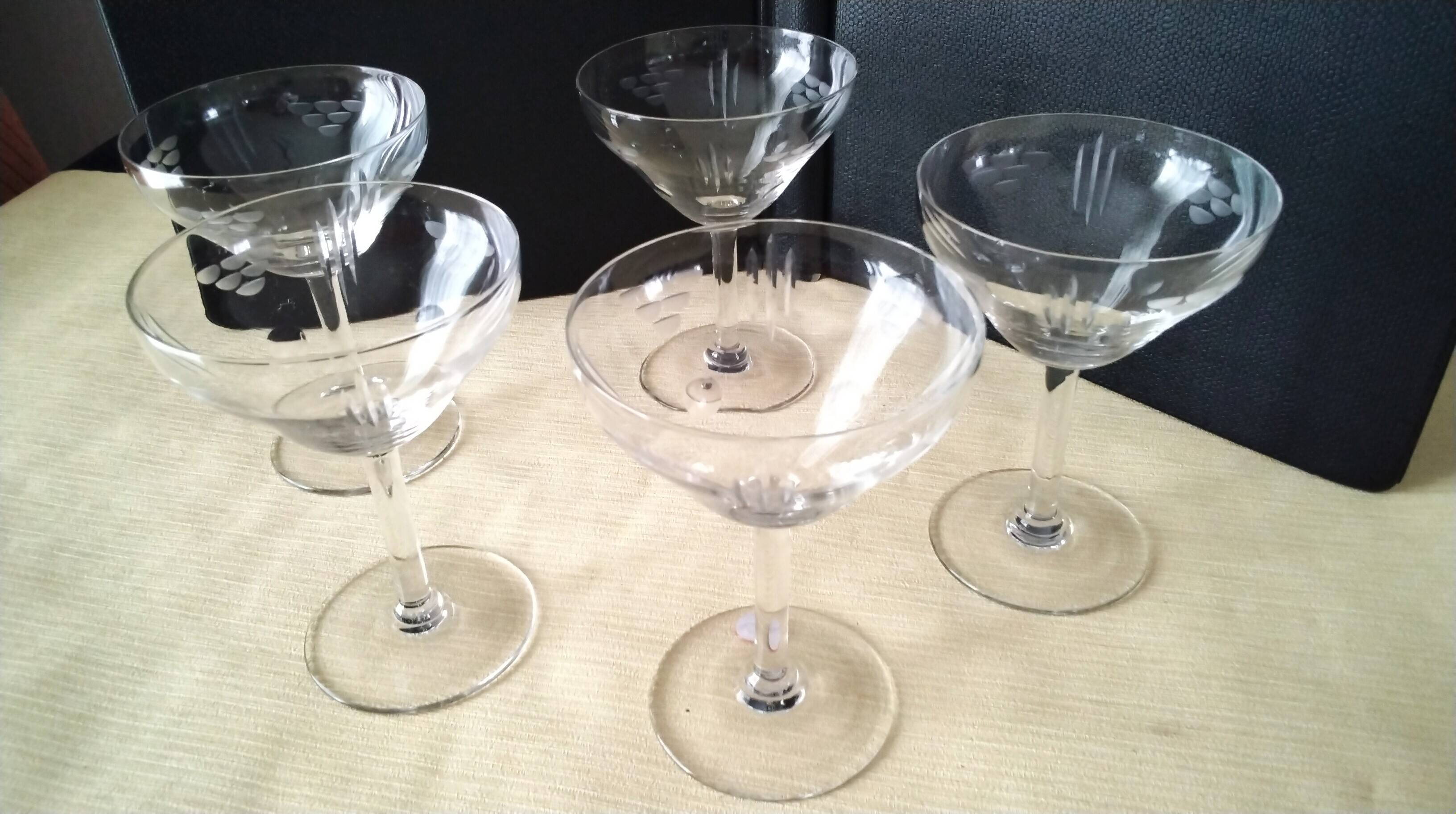 5 Vintage glass champagne coupes with engraved decoration