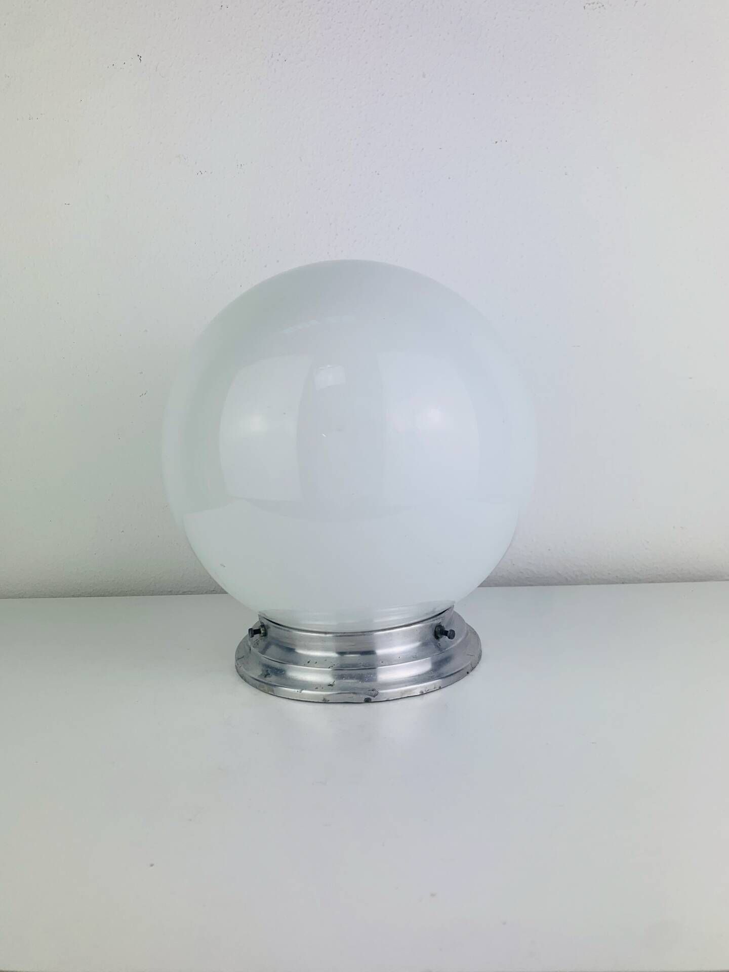 Wall light or ceiling light with opaline globe in Art Deco style.