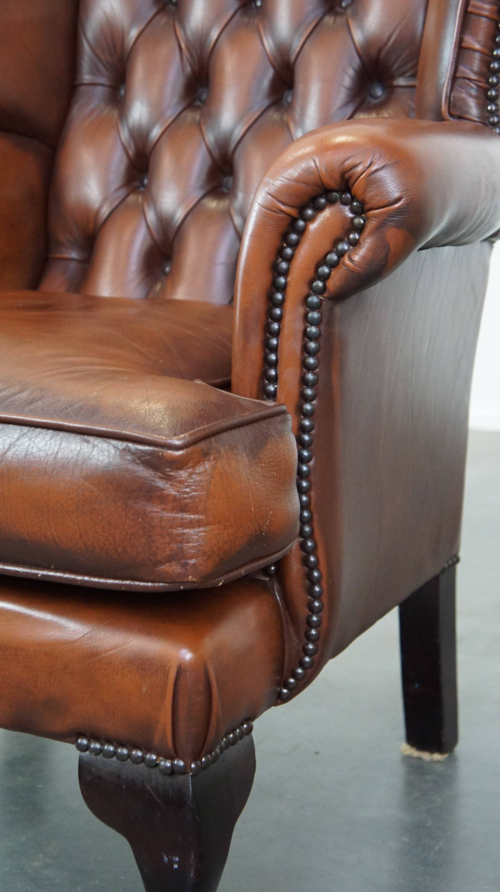 Brown leather wingback Chesterfield armchair