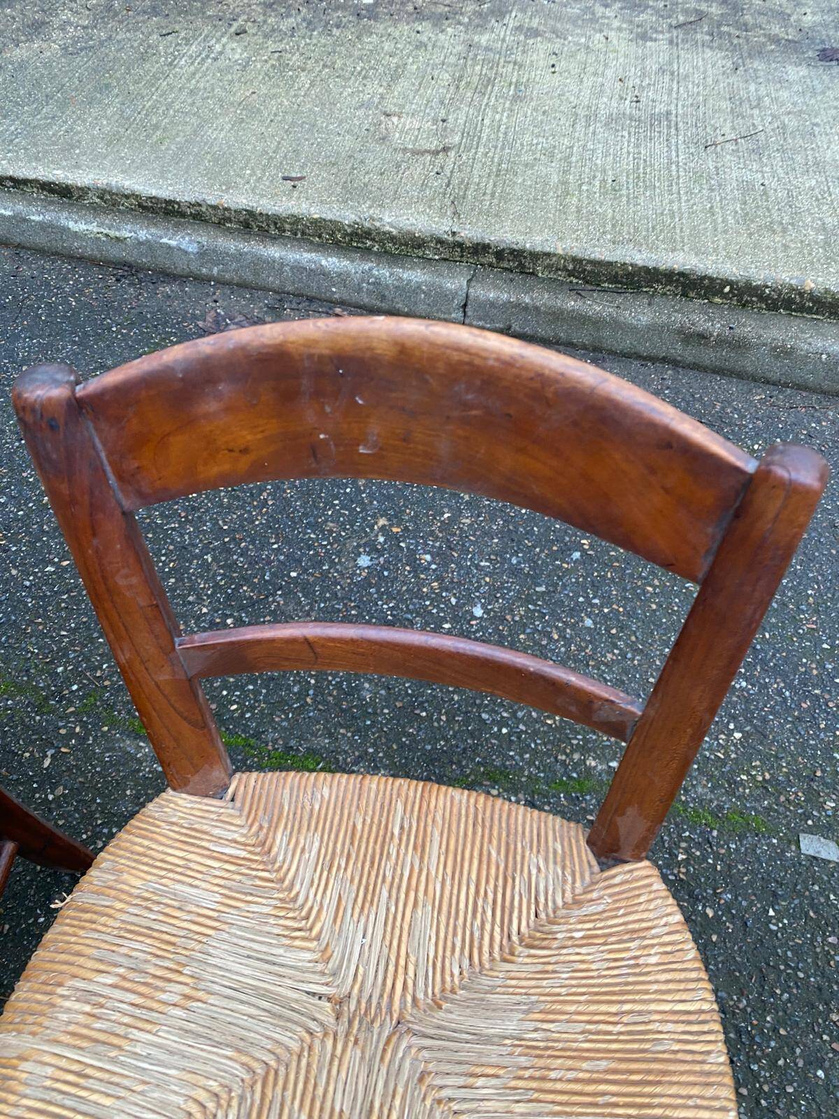 2 solid wood chairs with rush seats, child size.