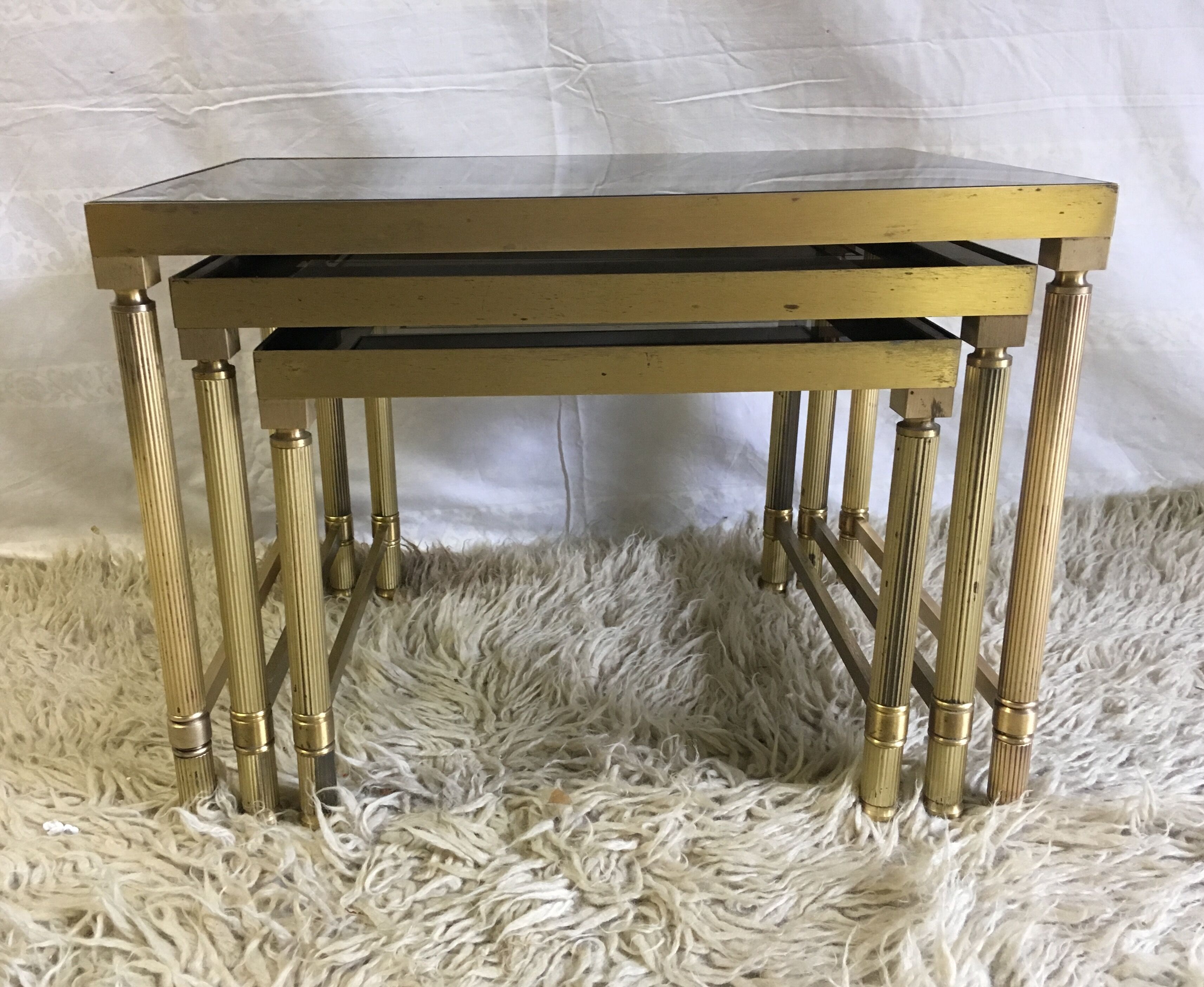 Brass and glass pull out tables 70