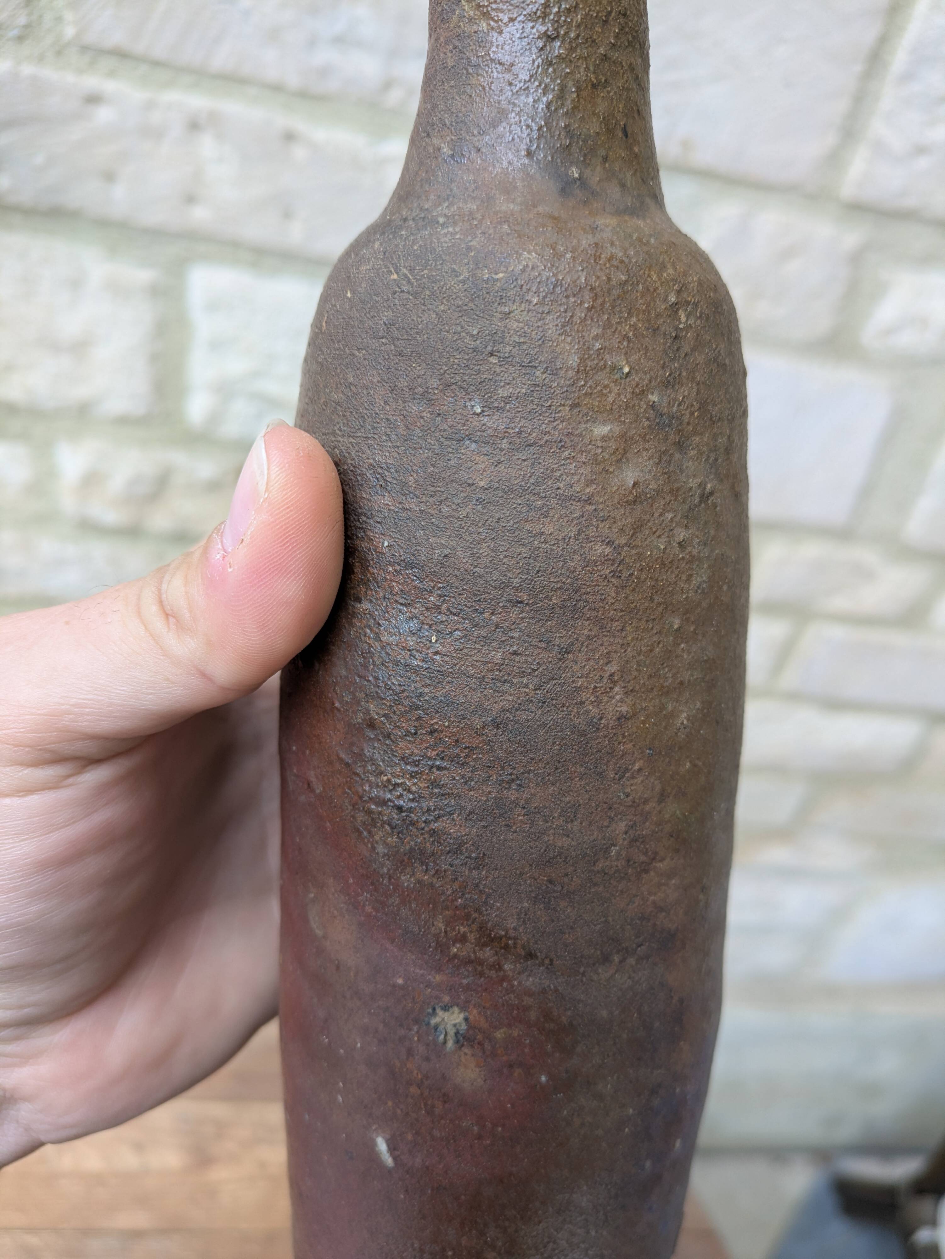 Old handmade terracotta bottle