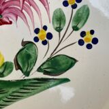 Old plate with flower and rooster pattern