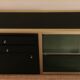 Console set and its mirror, black and gold, 80s