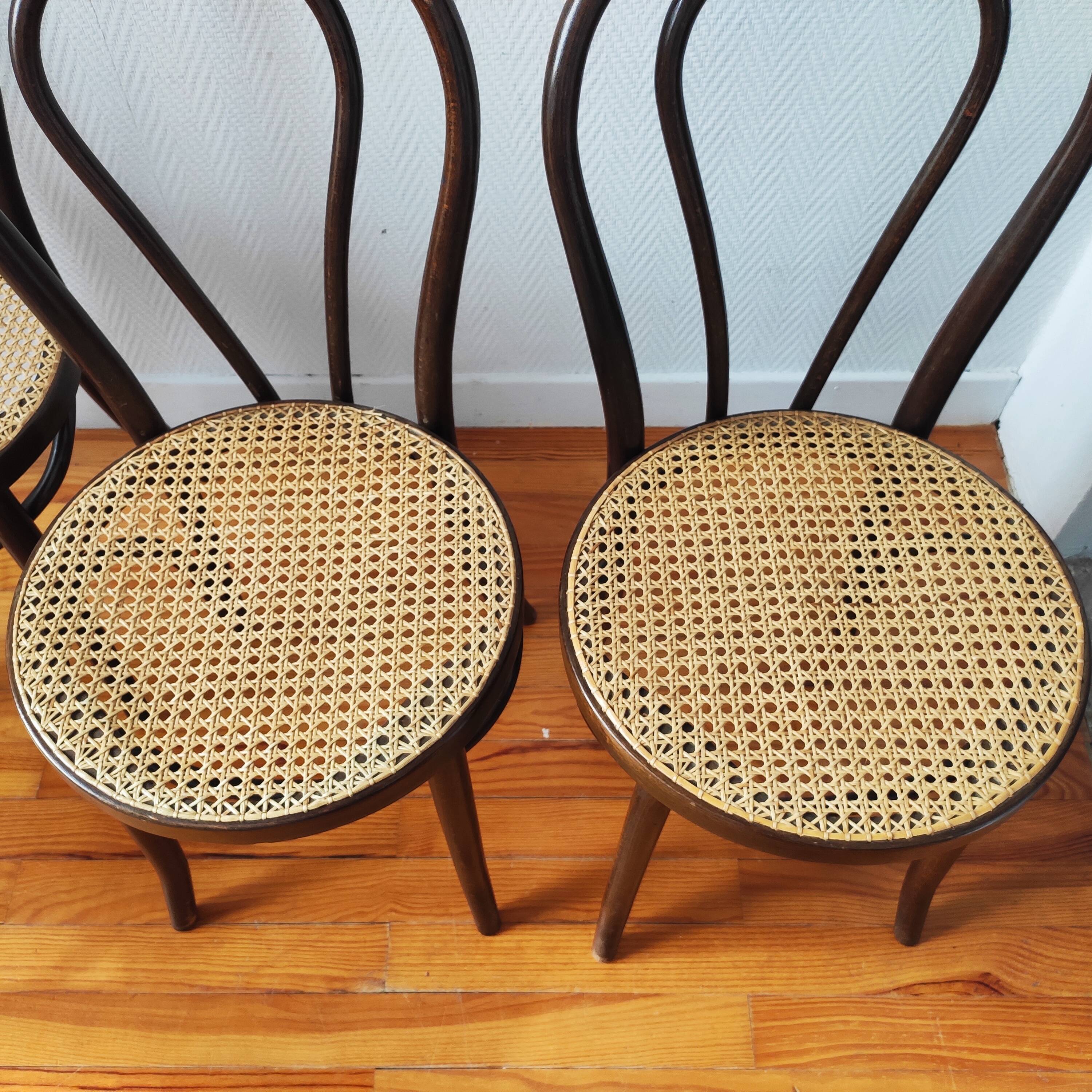 4 antique curved wood and cane chairs