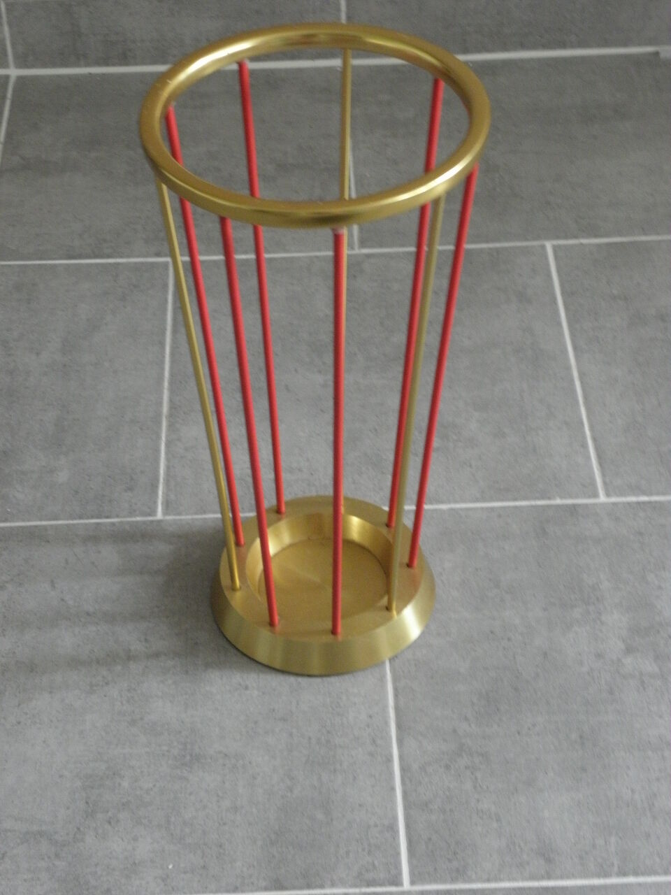 Golden and red umbrella holder