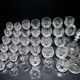 Baccarat set of 35 crystal glasses + 2 flower model carafes 9157 from 1907