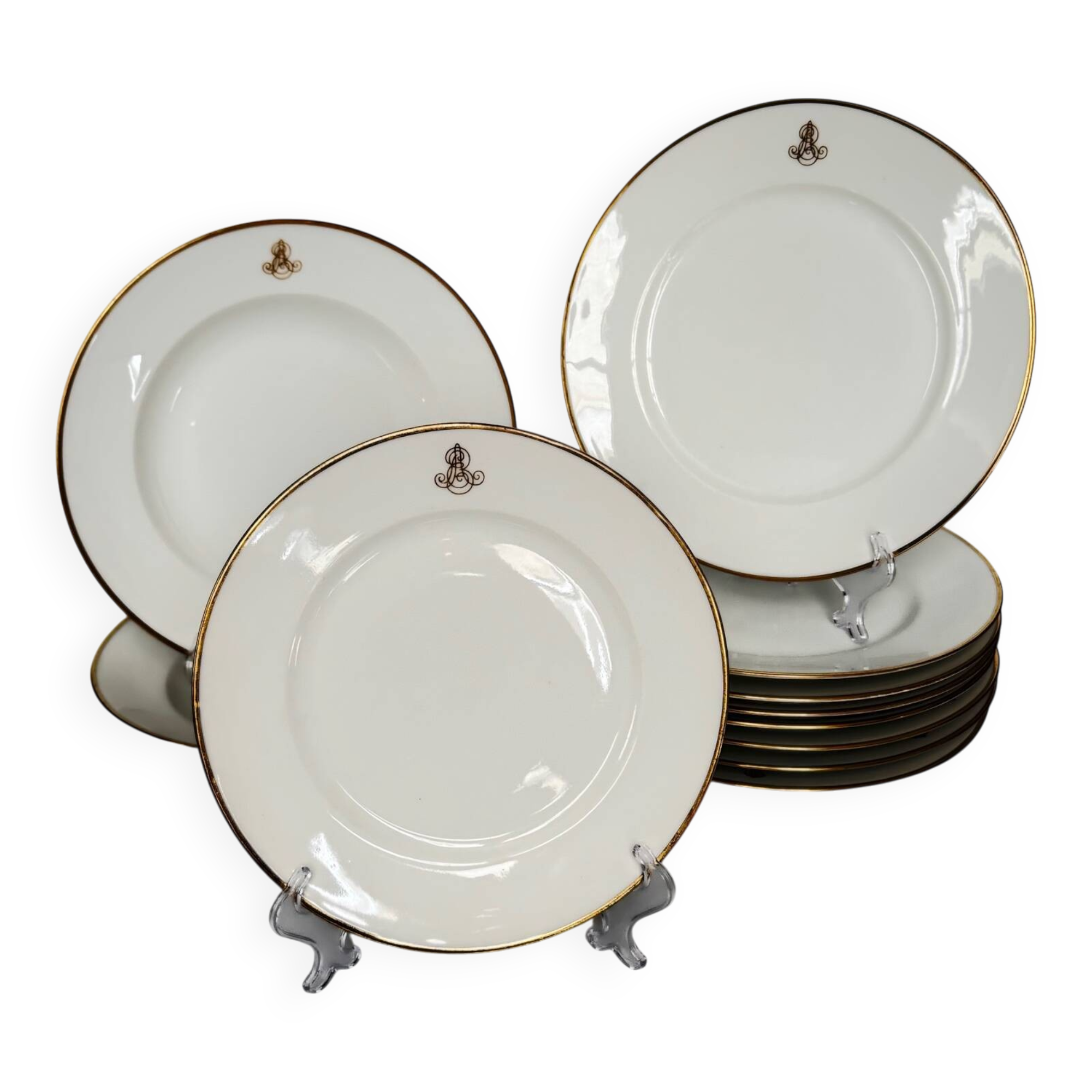 Set of monogrammed plates with gilt edges | E. Bourgeois | Late 19th century