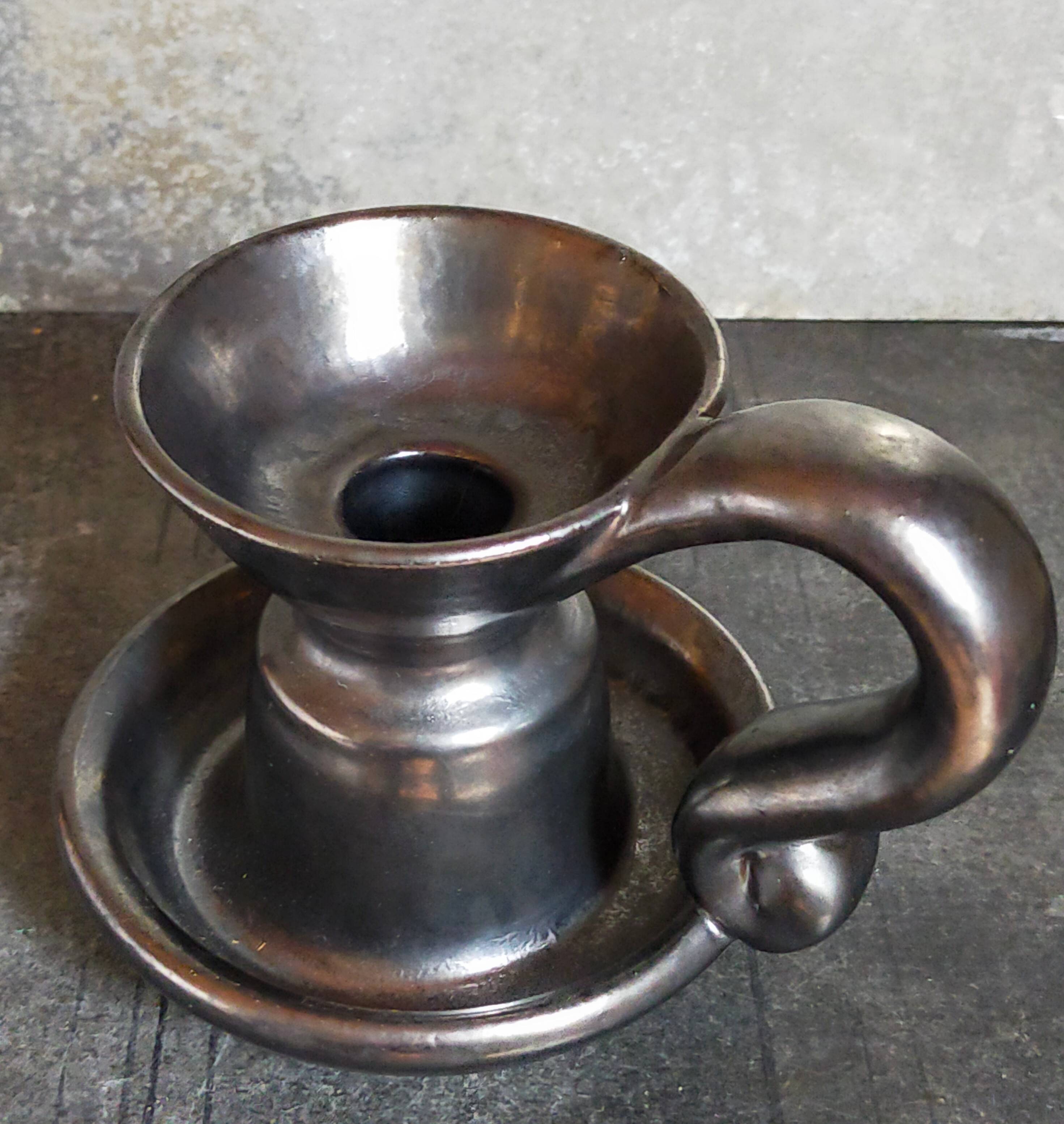 1950s iridescent black ceramic hand candle holder