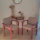 2 fauteuils léopard / bois massif bordeaux