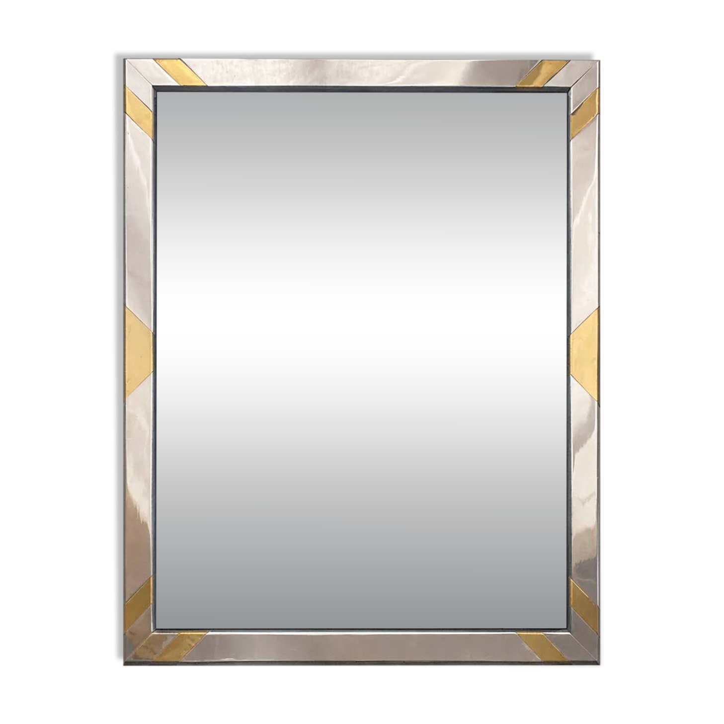 Faceted modernist wall mirror in steel and brass, geometric mixed metal frame 1970s.