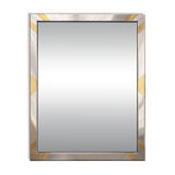Faceted modernist wall mirror in steel and brass, geometric mixed metal frame 1970s.
