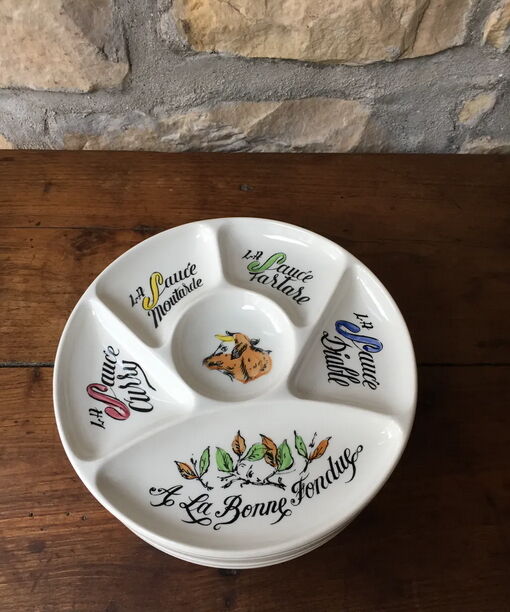 Six fondue plates by Gien