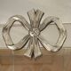 Lancel trivet, bow and ribbon, silver-plated metal
